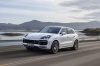 Driving 2019 Porsche Cayenne Turbo AWD in White from a front left three-quarter view